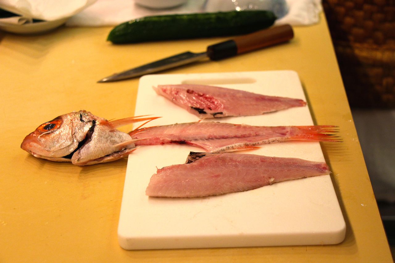 There are different ways to cut a fish for sushi. San-mai-oroshi (three-piece cut) is one of the common methods. It's done by separating the two side fillets.