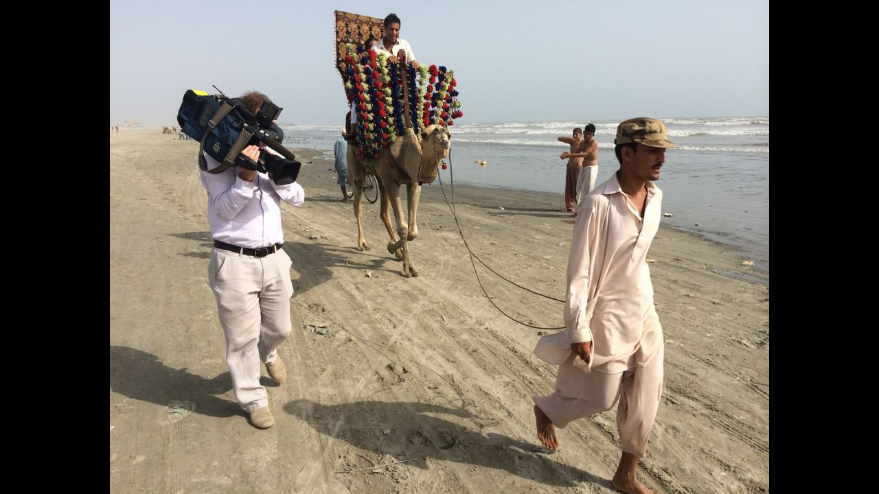 Gupta rides a camel in Karachi, Pakistan. "A beach. A camel. Karachi. Three things I never imagined going together," Gupta said. "But it ended up becoming the beginning of our whole journey."