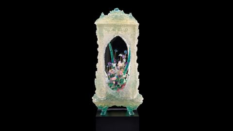 The pale green case for this work resembles fine jade, but it is made out of polyester resin.