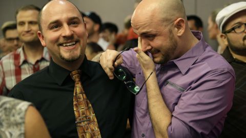 Joshua Gunter, right, and Bryan Shields attend a Las Vegas rally to celebrate an appeals court ruling that overturned Nevada's same-sex marriage ban on October 7, 2014.