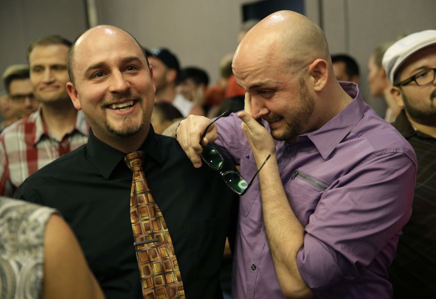 Joshua Gunter, right, and Bryan Shields attend a Las Vegas rally to celebrate an appeals court ruling that overturned Nevada's same-sex marriage ban on October 7, 2014.