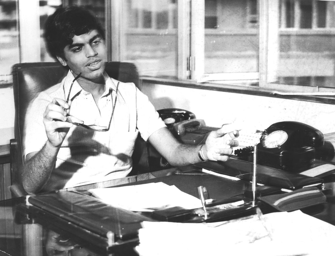  Zakaria pretends to be a grown-up at his mother's office in 1981.