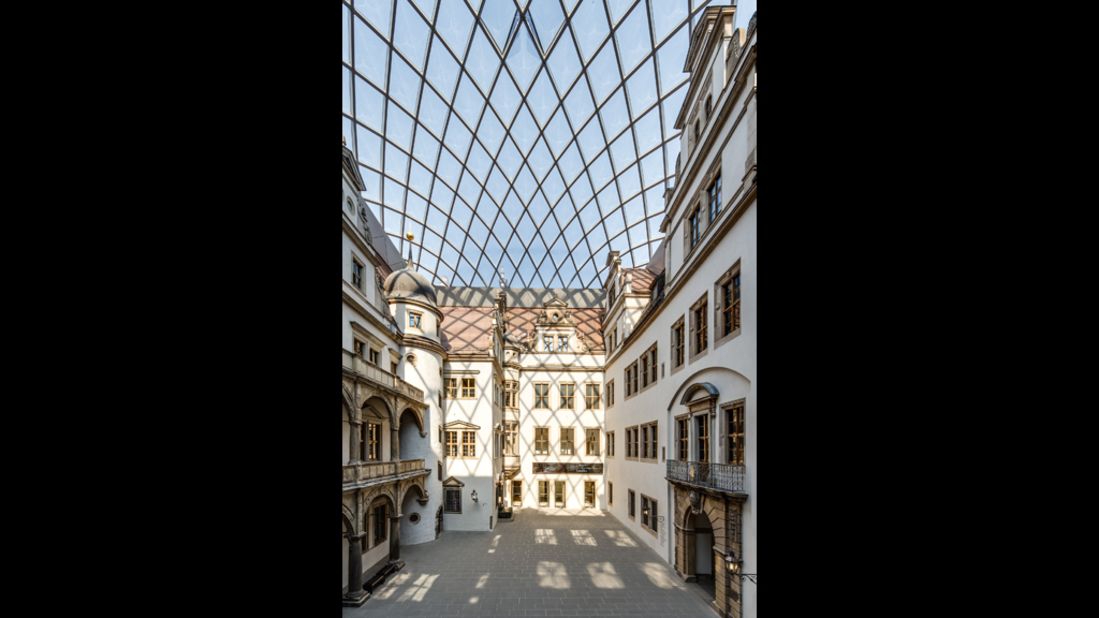 The inner courtyard of Dresden Castle is sheltered by a curved lattice glass roof designed by local architect Peter Kulka.