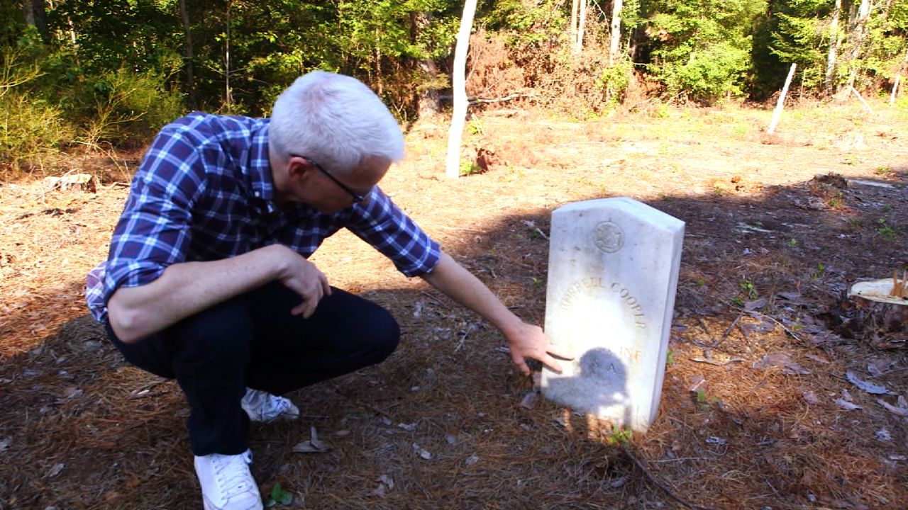 Cooper visits the grave site of Burrell C. Cooper, his great-great-grandfather who fought as a Confederate soldier in the Civil War.