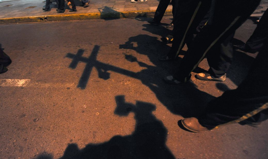 A group marches during a candlelight procession in Asuncion on the eve of Kurusu Ara, or Day of the Cross, on May 2, 2012. The Catholic religious festival is combined with native Guarani traditions.
