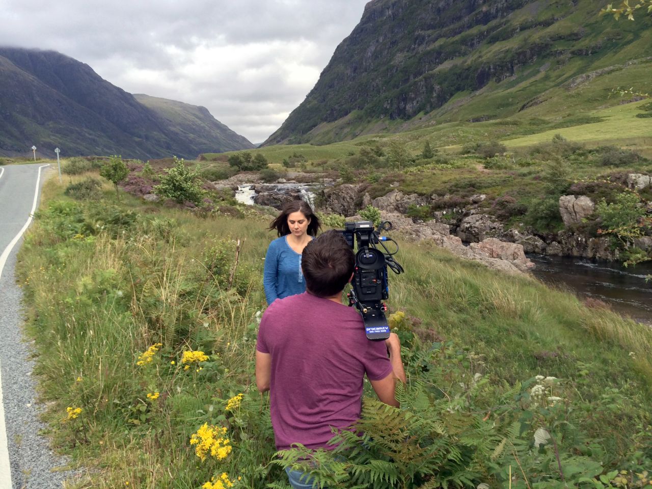Burnett shoots a segment among the rolling hills in the Isle of Skye.