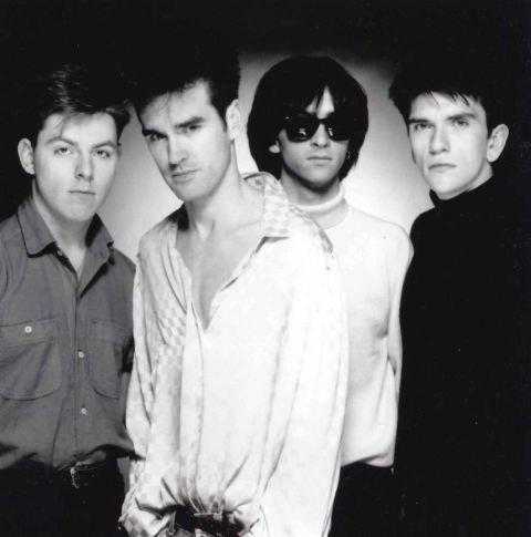 The Smiths, led by vocalist Morrissey (second from left) and guitarist Johnny Marr (third from left), combined Morrissey's mordant lyrics with Marr's jangly guitar to produce such songs as "Girlfriend in a Coma" and "Shoplifters of the World Unite."
