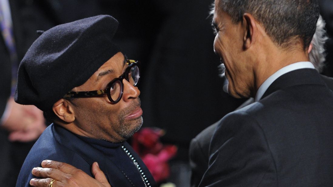 Director Spike Lee, shown here greeting President Barack Obama, shines his director's light on New York's problems. He fights for the Brooklyn borough where he was raised. 
