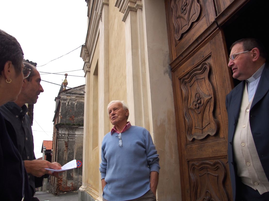 The author's mother meets a priest in Candia Canavese, Italy.