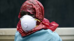 A Red Cross member of staff looks on after collecting the corpse of a female victim of the Ebola virus from her home, in Monrovia, on September 29, 2014. Of the four west African nations affected by the Ebola outbreak, Liberia has been hit the hardest, with 3,458 people infected -- more than half of the total number of cases. Of those, 1,830 have died, according to a WHO count released on September 27. 