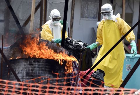 In Liberia, medical staff burn clothes belonging to Ebola patients to help stop the spread of the virus. 