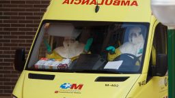 Medical workers wearing protective clothing arrive at an apartment building, the private residence for Spanish nurse, Teresa Romero who has tested positive for the Ebola virus on October 8, 2014 in Alcorcon, near Madrid, Spain.