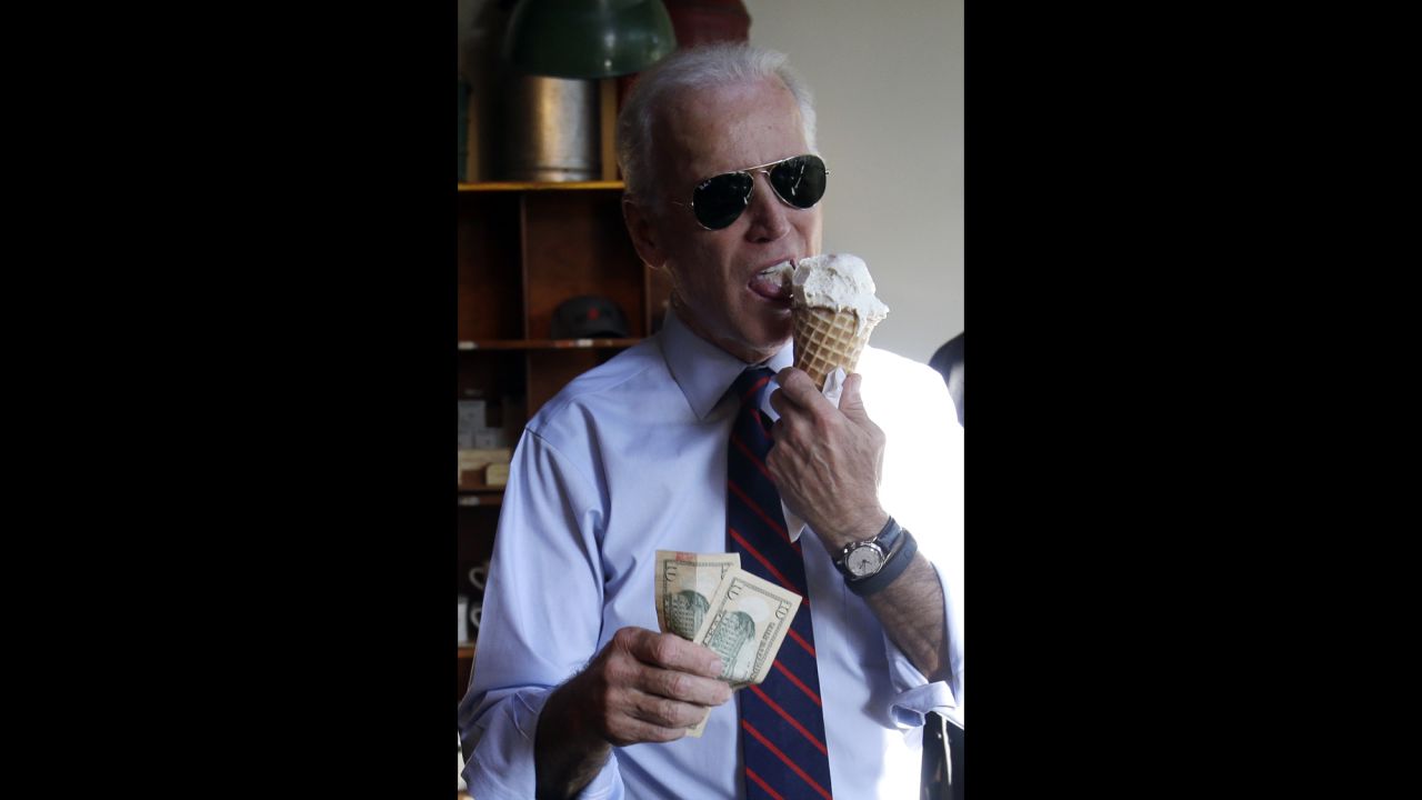 Biden gets ready to pay for an ice cream cone after a campaign rally for Sen. Jeff Merkley in Portland, Oregon, on October 8.