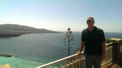 Chris Cuomo, in a rare moment of downtime between shoots for the ROOTS project, posing along the famed Amalfi Coast.