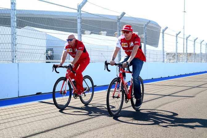 Alonso's current teammate Kimi Raikkonen (right) cycles around the new track at Sochi, which winds around the renovated resort town's Olympic park and is an unfamiliar circuit for the drivers.