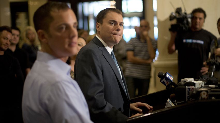 FILE - In this Wednesday, Nov. 7, 2012 file photo, San Diego city councilman Carl DeMaio, Republican candidate for mayor, center, gives a news conference alongside his partner Jonathan Hale, left, in San Diego. DeMaio conceded defeat to Democratic Congressman Bob Filner in the race for mayor of the country's eighth-largest city.  (AP Photo/)