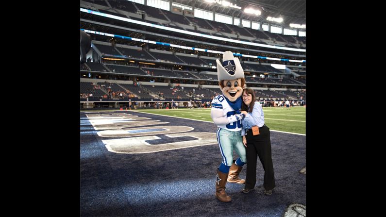 Highsmith began to feel better and have more energy the more she exercised and ate right. Here, she embraces the Dallas Cowboys mascot.