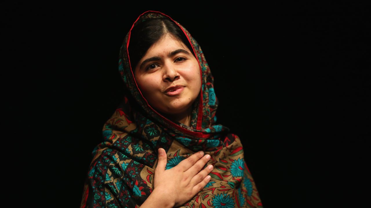 Malala Yousafzai acknowledges the crowd at a press conference at the Library of Birmingham after being announced as a recipient of the Nobel Peace Prize, on October 10, 2014 in Birmingham, England.