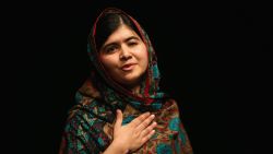 Malala Yousafzai acknowledges the crowd at a press conference at the Library of Birmingham after being announced as a recipient of the Nobel Peace Prize, on October 10, 2014 in Birmingham, England.