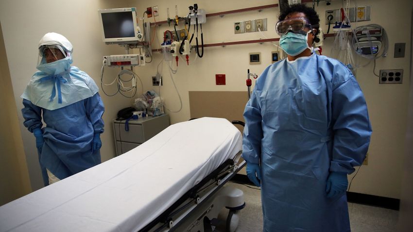 NEW YORK, NY - OCTOBER 08: Members of Bellevue Hospital staff wear protective clothing as they demonstrate how they would receive a suspected Ebola patient on October 8, 2014 in New York City. If the patient was confirmed to be carrying the deadly virus the person would be sent to an isolation unit for treatment. The first person diagnosed with Ebola in the United States, Liberian Thomas Duncan, has died at a Dallas hospital, Texas Health Presbyterian Hospital said. (Photo by Spencer Platt/Getty Images)
