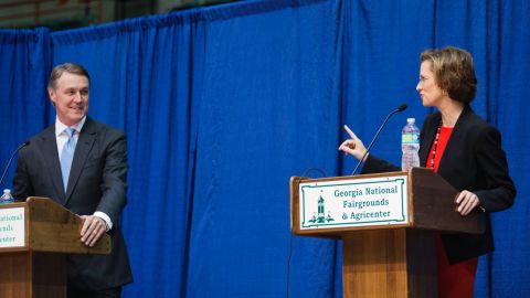 Georgia Democratic candidate for U.S. Senate Michelle Nunn, right, speaks as Republican candidate David Perdue looks on during a debate, Tuesday, Oct. 7, 2014, in Perry, Ga.