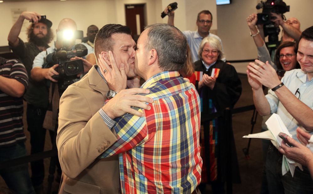 Chad Biggs, left, and Chris Creech say their wedding vows at the Wake County Courthouse in Raleigh, North Carolina, on October 10, 2014, after a federal judge ruled that same-sex marriage can begin in the state.