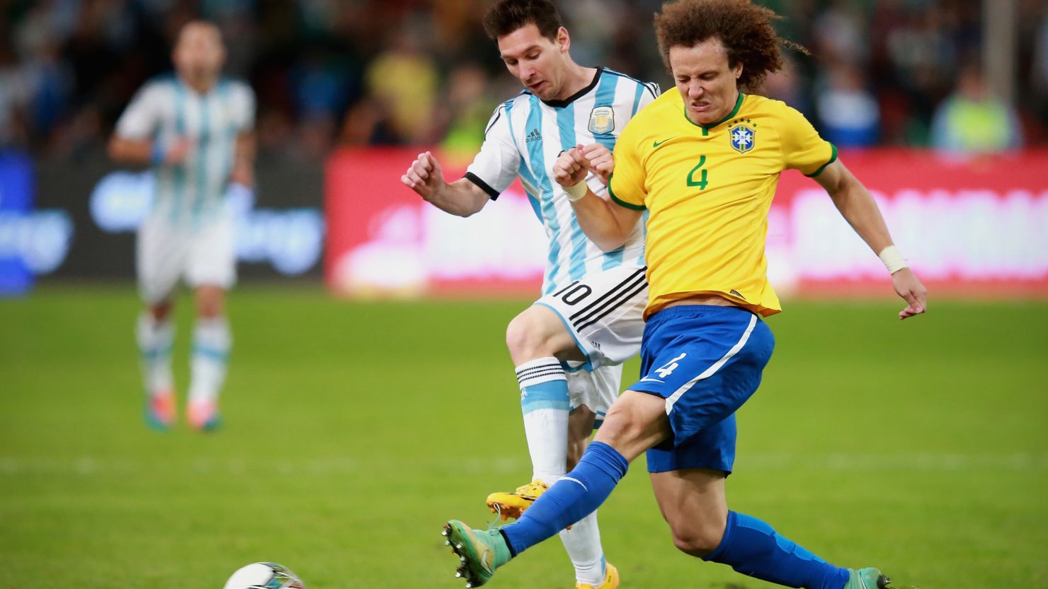 Lionel Messi (left) and David Luiz tangle for the ball as Argentina face Brazil in a freindly Beijing.