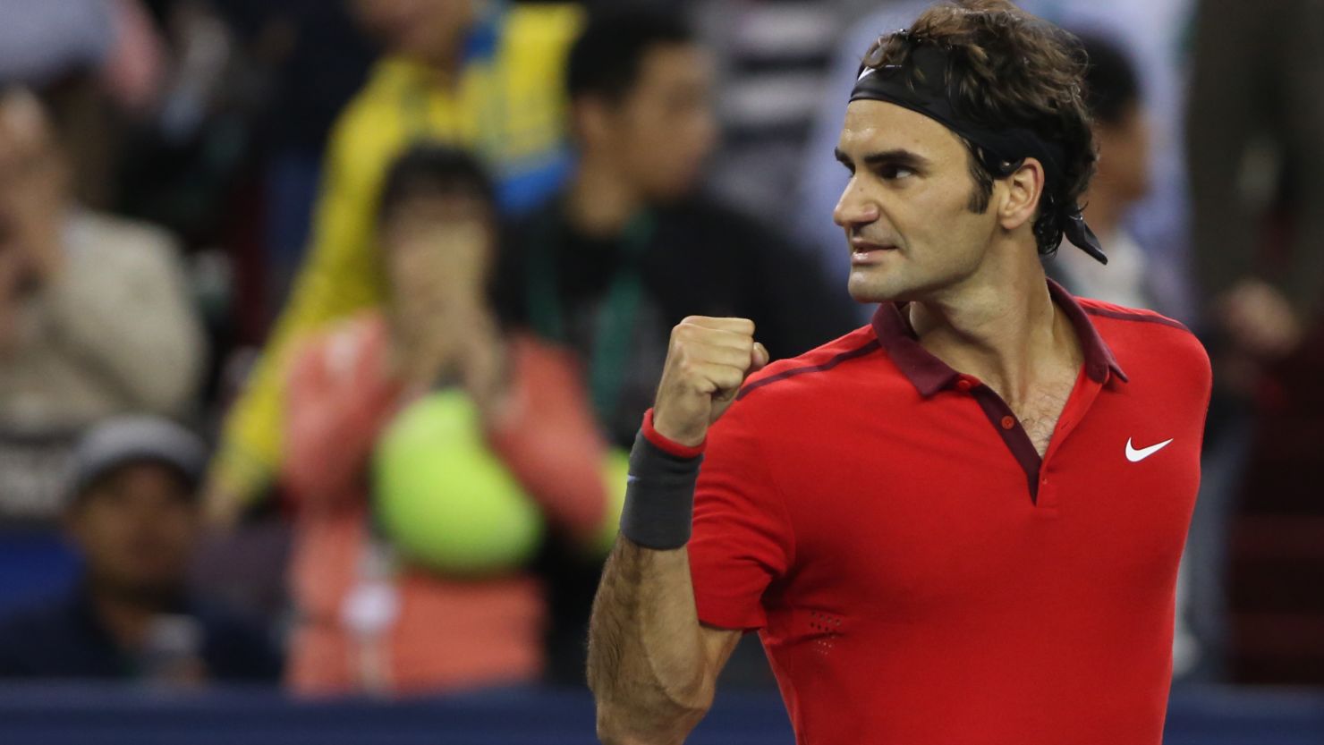 Roger Federer  reacts after winning his semifinal match against Novak Djokovic at the Shanghai Masters.