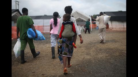 Ebola survivors prepare to leave a Doctors Without Borders treatment center after recovering from the virus in Paynesville, Liberia, on October 12, 2014.