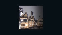 : 	Images of an ISIS parade in the Kirkuk Province