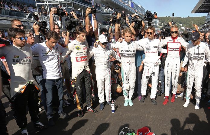 There are subdued scenes in Sochi as the Formula One drivers hold a minute's silence before the race in respect for stricken Marussia racer Jules Bianchi, who was seriously injured at the Japanese Grand Prix.
