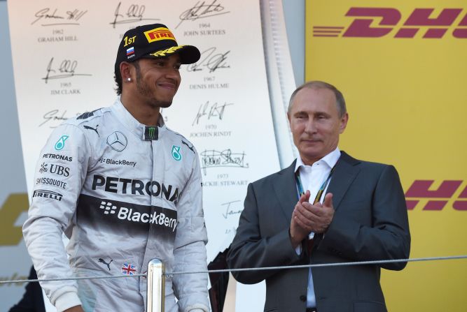 Race winner Lewis Hamilton is joined on the podium by Russian President Vladimir Putin.