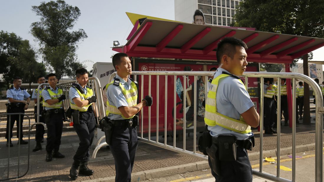 Police officers remove barricades used by protesters on October 13.