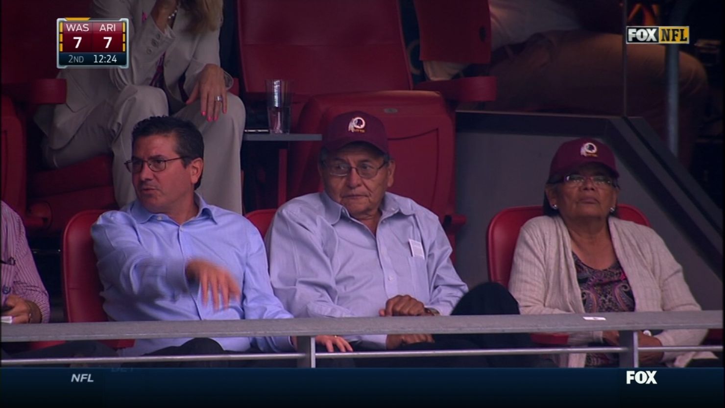 Redskins owner Dan Snyder (L) sits with Navajo President Ben Shelly and his wife at the Cardinals vs. Redskins game in Arizona on Sunday. 