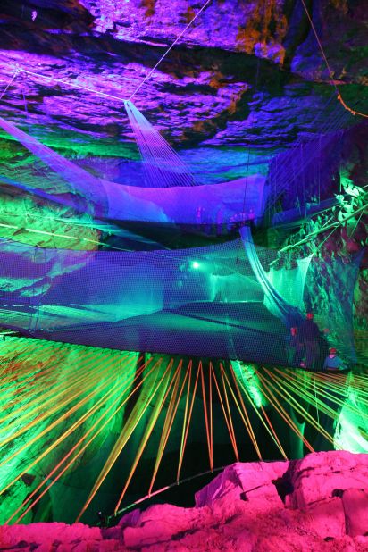 The highest trampoline is suspended 180 feet (55 meters) above the cavern floor.
