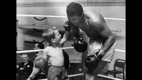 Patrick Power, 6, takes on Ali in the ring in 1963. Patrick was taking boxing lessons after getting bullied.