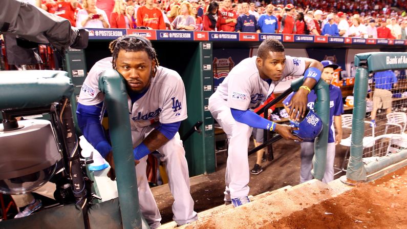 Los Angeles Dodgers Hanley Ramirez, left, and Yasiel Puig watch from the dugout steps in St. Louis after the St. Louis Cardinals defeated the Dodgers in Game 4 of the National League Division Series on Tuesday, October 7. The loss eliminated the Dodgers from the postseason.