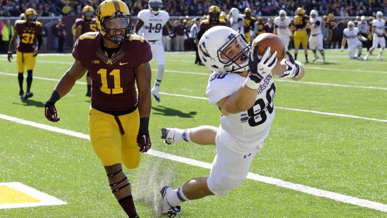 Northwestern wide receiver Austin Carr pulls in a pass Saturday, October 11, against Minnesota, but he landed out of bounds. Minnesota would go on to win the Big Ten game 24-17.
