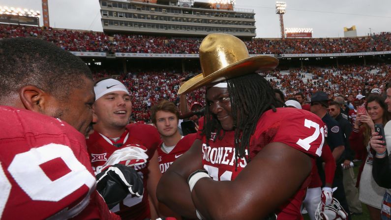Oklahoma offensive lineman Tyrus Thompson wears the Golden Hat after the Sooners defeated Texas 31-26 in the Red River rivalry game Saturday, October 11, in Dallas.