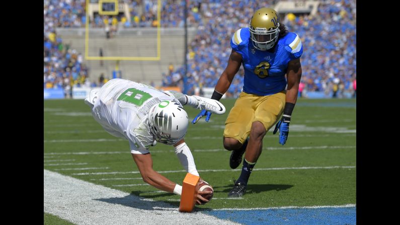 Oregon quarterback Marcus Mariota dives for a touchdown Saturday, October 11, as the Ducks won 42-30 at UCLA.