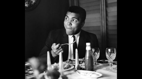 Ali eats at a restaurant in 1965.