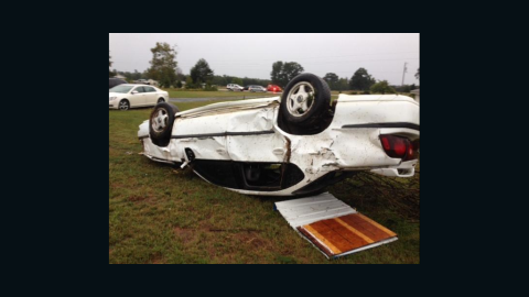 A car is damaged after severe weather passed through Little River County, Arkansas, on Monday.