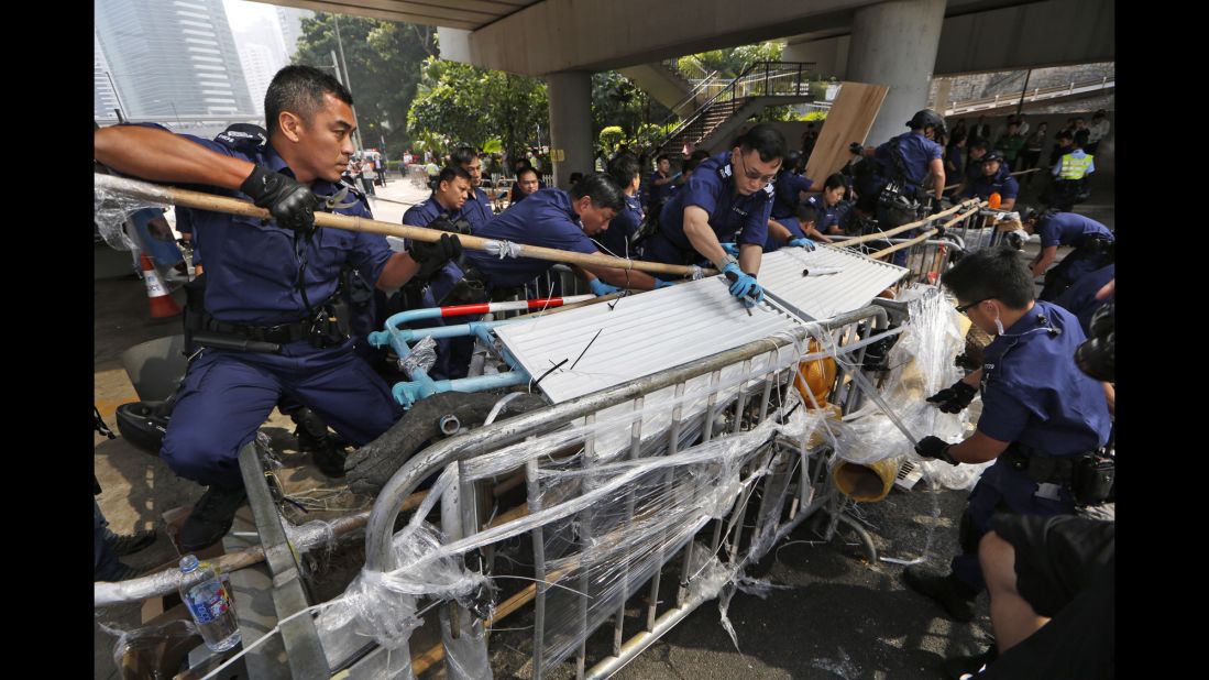 Police dismantle barricades from the streets on October 14.