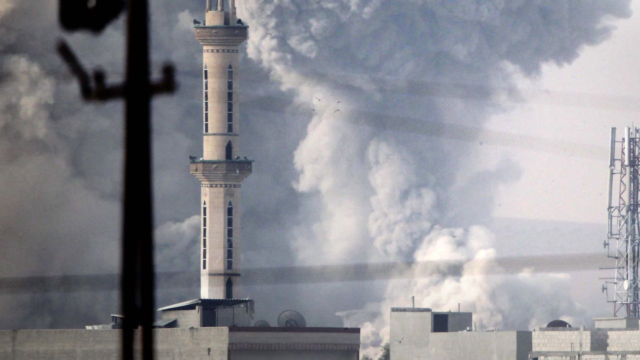 Smoke billows following an airstrike by US-led coalition aircraft in Kobani, Syria, during fighting between Syrian Kurds and militants from Islamic State, on October 14, 2014 as seen from the outskirts of Suruc, on the Turkey-Syria border. The strategic border town of Kobani has been beseiged by Islamic State militants since mid-September forcing more than 200,000 people to flee into Turkey.