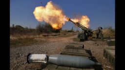 Pro-Russian rebels fire artillery toward Ukrainian position at Donetsk Sergey Prokofiev International Airport outskirts the city of Donetsk, eastern Ukraine Tuesday, Oct. 14, 2014. (AP Photo/Dmitry Lovetsky)