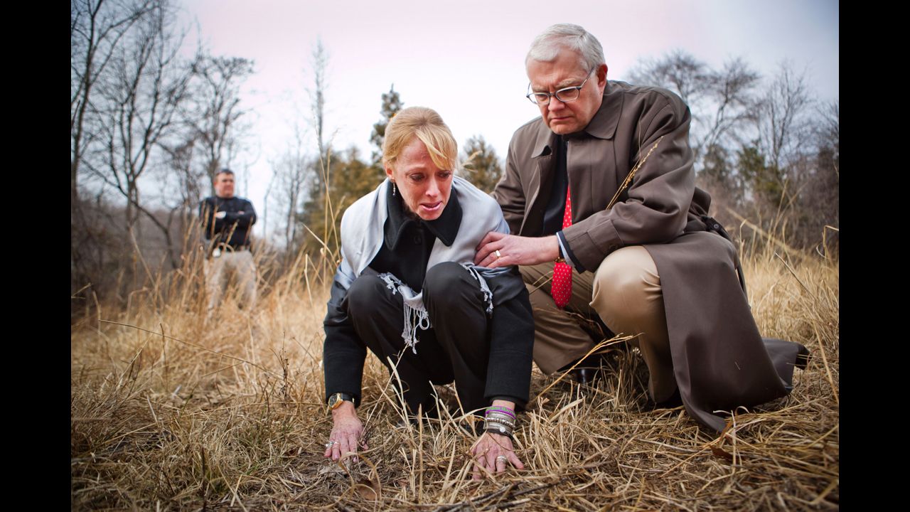 Gil Harrington, left, is supported by her husband, Dan Harrington, while visiting the site where their daughter Morgan Harrington's remains were discovered in January 2011 in Charlottesville, Virginia.
