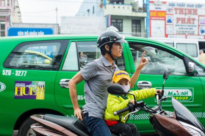 Scooters and motorcycles are an integral means of transportation in Vietnam. 