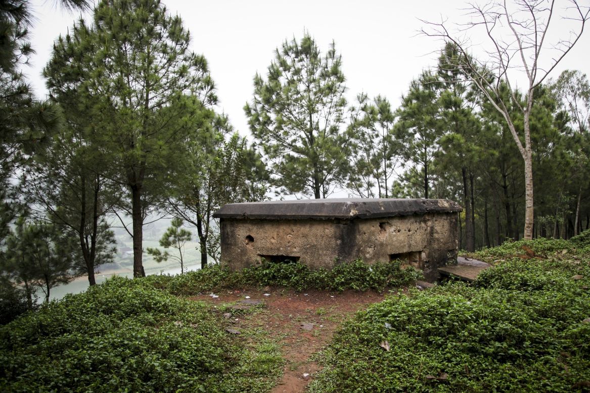 An old American bunker rests on a hillside perched above the Perfume River in Hue.
