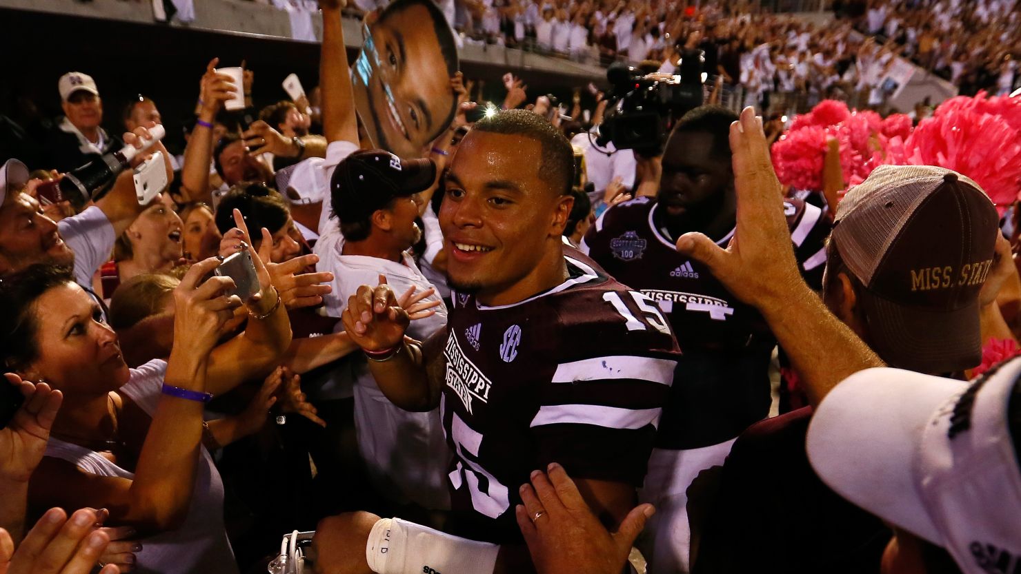 Dak Prescott of the Mississippi State Bulldogs celebrates with fans after their 38-23 win over the Auburn Tigers on October 11. 