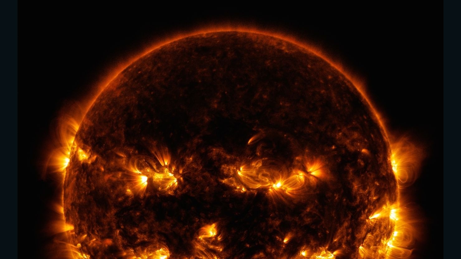 Active regions on the sun combined to resemble a jack-o-lantern's face on Oct. 8, 2014. The image was captured by NASA's Solar Dynamics Observatory, or SDO.